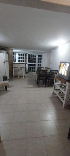 a large room with tables and chairs in a room at BackPakersBasic in Tigre