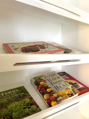 two shelves of a refrigerator filled with food at Castle View Hotel Samal in Magamomo