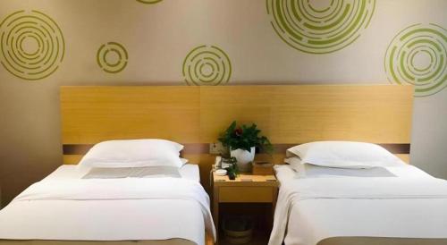 Ένα ή περισσότερα κρεβάτια σε δωμάτιο στο GreenTree Inn Heze Danxian Shangmaocheng Business Branch