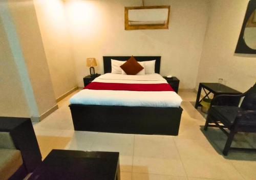 Postel nebo postele na pokoji v ubytování Hotel Signature Express