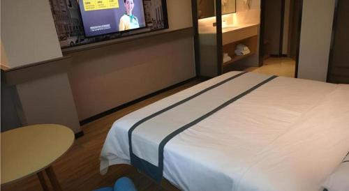 Ένα ή περισσότερα κρεβάτια σε δωμάτιο στο City Comfort Inn Mianyang Southwest University Of Science And Technology