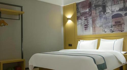 Letto o letti in una camera di City Comfort Inn Liupanshui Sports Center