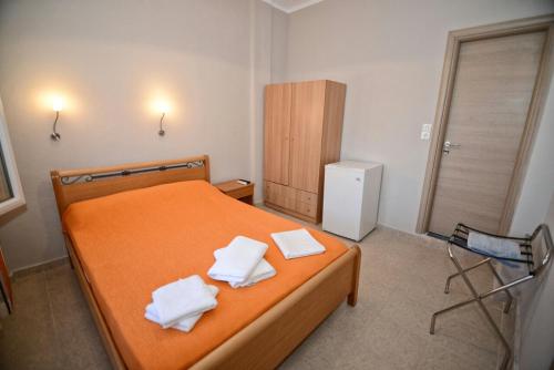 Ένα ή περισσότερα κρεβάτια σε δωμάτιο στο Melissa Rooms