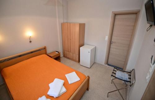 Ένα ή περισσότερα κρεβάτια σε δωμάτιο στο Melissa Rooms