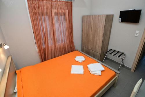 Ένα ή περισσότερα κρεβάτια σε δωμάτιο στο Melissa Rooms
