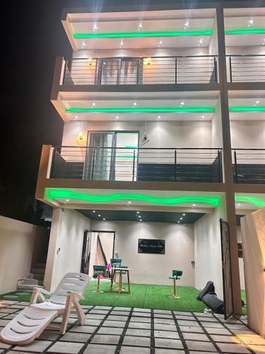 a building with a patio with a table and chairs at Adonai villa 2 in Albion