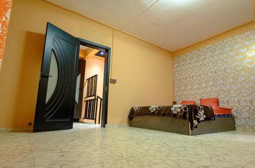 a room with a bed and a large door at Adonai villa 2 in Albion
