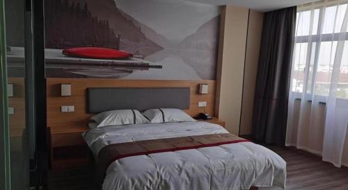 a bedroom with a bed with a red pillow on it at Thank Inn Hotel Jiangsu Wuxi High-Tech Zone Ruigang Pedestrian Street in Wuxi
