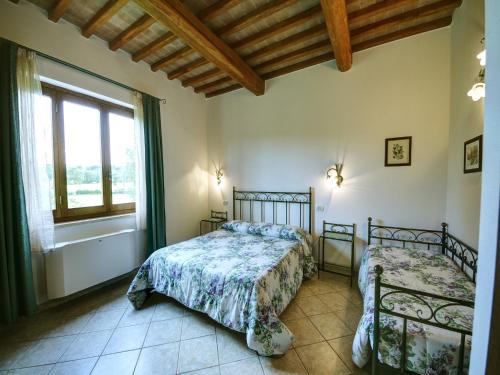 Postel nebo postele na pokoji v ubytování Saturnia Pian Di Cataverna