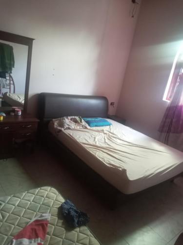 Ένα ή περισσότερα κρεβάτια σε δωμάτιο στο Delft Av home stay and food provider
