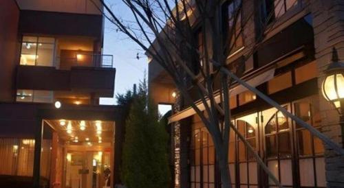a view of a building at night with lights at Hotel Miyoshino Annex in Sano