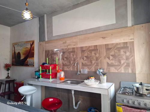 a kitchen with a sink and a counter top at Dormitorio KAPULLANA Jr Junin 263 barrio norte con cocina baño privado in Piura