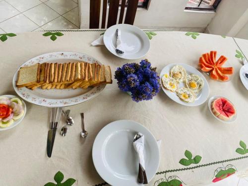 a table with plates of food and eggs on it at GB Royal Stay Nuwara Wewa in Nikawatawana
