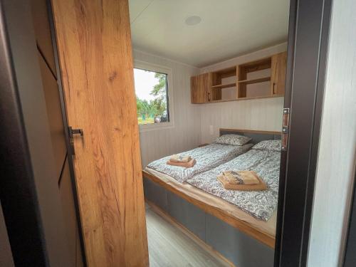 Postel nebo postele na pokoji v ubytování Sportowa Osada