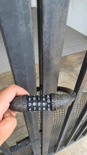 a persons hand holding a metal object with spikes at Deena Homestay - 4BR with 4 Airconds in Jerantut