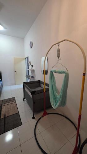 a room with a bed and a tennis racket at Deena Homestay - 4BR with 4 Airconds in Jerantut