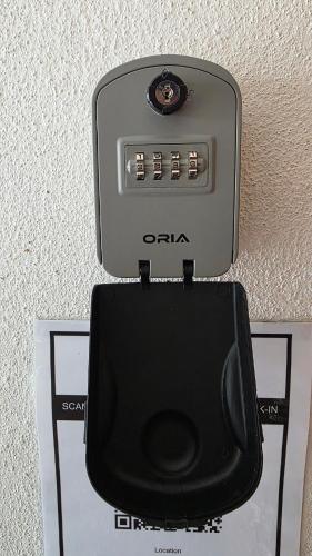 a tv sitting on top of a wall at Deena Homestay - 4BR with 4 Airconds in Jerantut