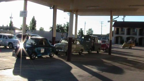 a group of cars parked in a gas station at Travelodge by Wyndham Holbrook in Holbrook