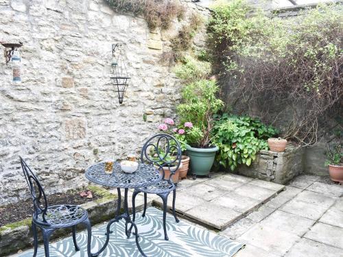 a table and chairs sitting on a patio at The Croft in Stanhope