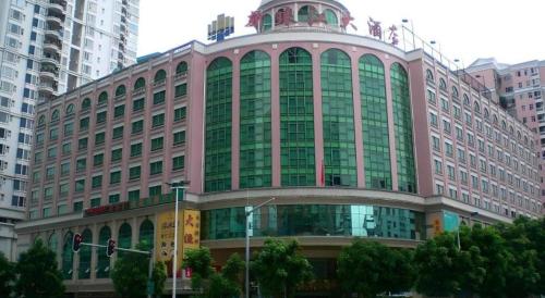 a large building with a dome on top of it at New Pearl River Hotel in Guangzhou