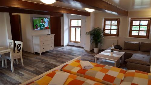 a large living room with a bed and a couch at Holiday Homes Buchholz in Büsum
