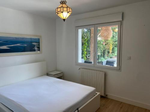 Ένα ή περισσότερα κρεβάτια σε δωμάτιο στο Villa Mauret Plage