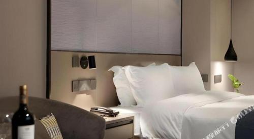 Cama o camas de una habitación en Shenzhen Hanyong Hotel Fuyong Branch