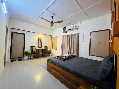 a bedroom with a large bed in a room at Serene Stays in Jorhat