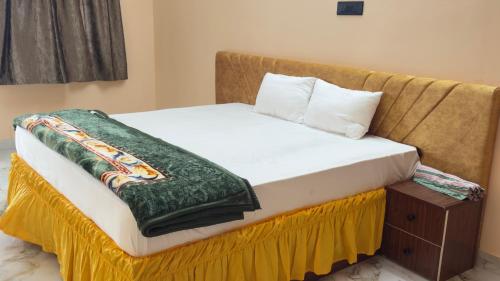 Hotel Prisha Recidencyにあるベッド