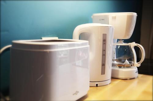 two white appliances sitting on top of a counter at L'Atelier in Strasbourg