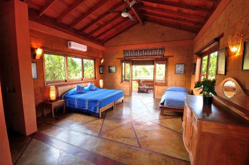 a bedroom with a blue bed in a room at Hotel Casa San Pancho in San Francisco