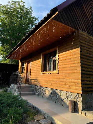 a house with spider webs on the side of it at Медвежий in Rakhiv