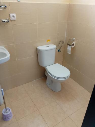 a bathroom with a toilet and a sink at Jardin latlantique in Tangier