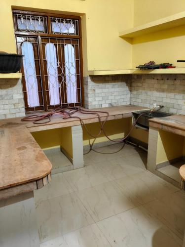 a room with a table and a window in it at Lal saheb house in Rānchī