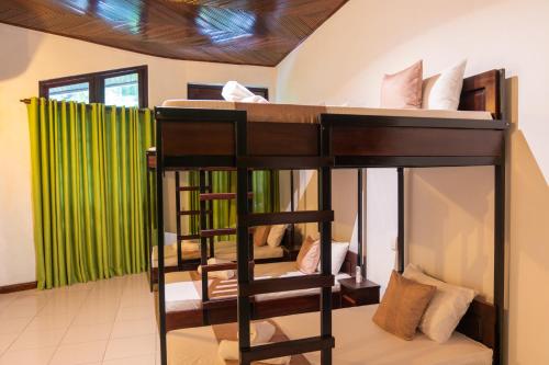 a room with a bunk bed in a room at Tribe Hostel in Kandy