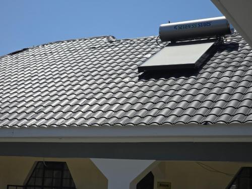a roof with a solar panel on top of it at Nyodera Homes Furnished Apartments in Oyugis