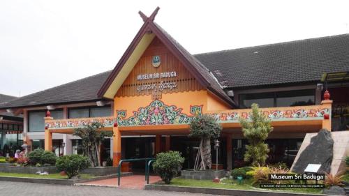 a building with a cross on the front of it at Raffleshom Hotel in Bandung