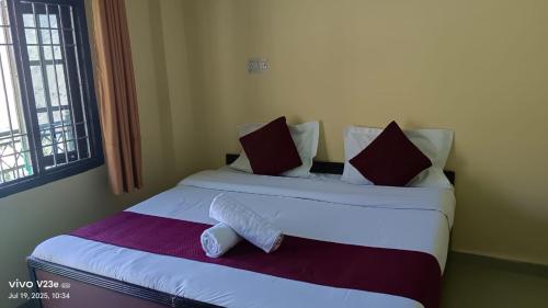 a bedroom with two beds with pillows and a towel at Hotel Nanak bharmour manimahesh in Brāhmaur