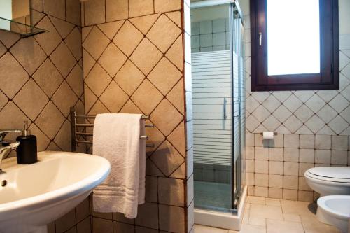 a bathroom with a sink and a toilet at I 5 SENSI in Marina di Modica