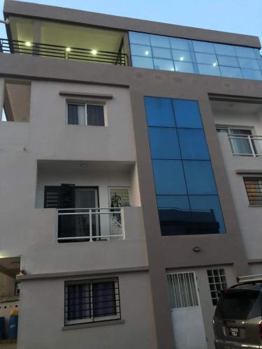 a building with a lot of glass windows at Apartment with 360-degree view in Antananarivo