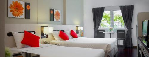 Llit o llits en una habitació de The Inn Saladaeng
