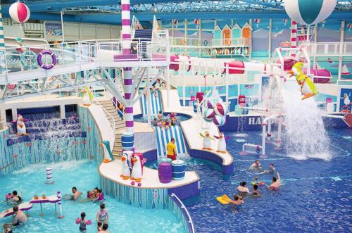 a group of people in an indoor water park at Linzis Coastal Caravan in Ayr