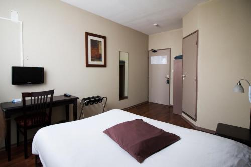 Postel nebo postele na pokoji v ubytování Ambiance Hotel
