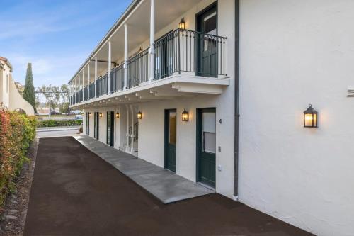 an empty hallway of a building with a balcony at Casa Jardin - Boutique Suites in Downtown Santa Barbara in Santa Barbara