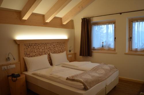 a bedroom with a large bed in a room at Chalet Serena in Roncegno