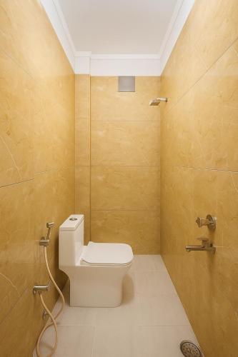 a bathroom with a toilet and a shower at Vasavi Palace Residency in Pennāttūr