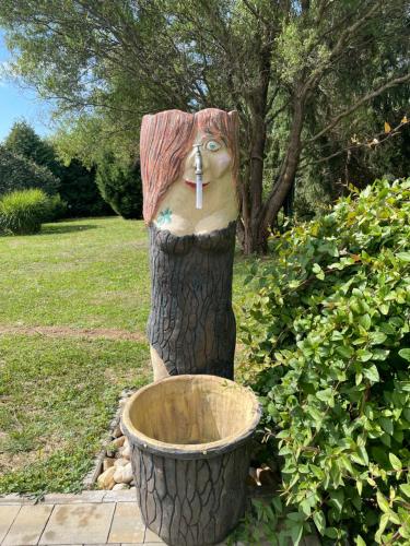 a statue of a woman with a toothbrush in her mouth at Vamiš in Gornji Petrovci