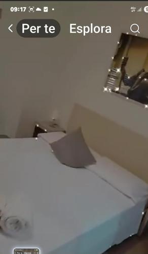 a picture of a bed in a room at Le Sculture B&B in Cosenza