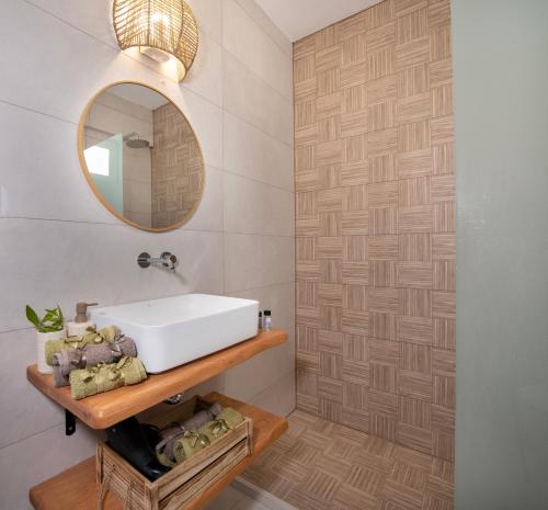 a bathroom with a sink and a mirror at Elenas Village house - Dream apt w Pool & Terrace in Alikianós