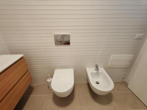 a bathroom with a toilet and a sink at Casa vacanza relax in Ortona
